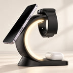 Black Charge Arc holding a phone, watch and earbud case with its warm light on.