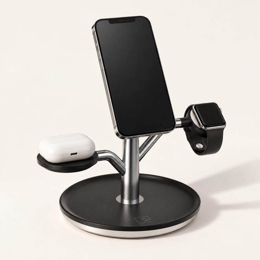 Black Charge Tree holding a phone, watch and earbud case on a warm off-white background.