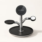 The empty Black Charge Tree with its magnetic face, watch puck and earbud pad.